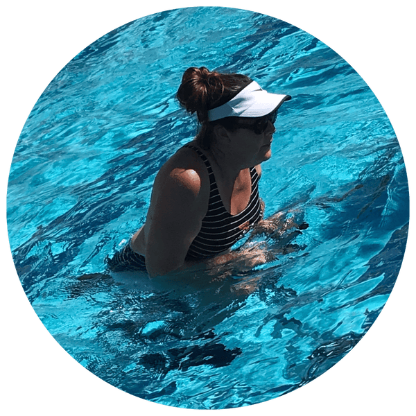 Woman with a knee replacement water cycling in pool