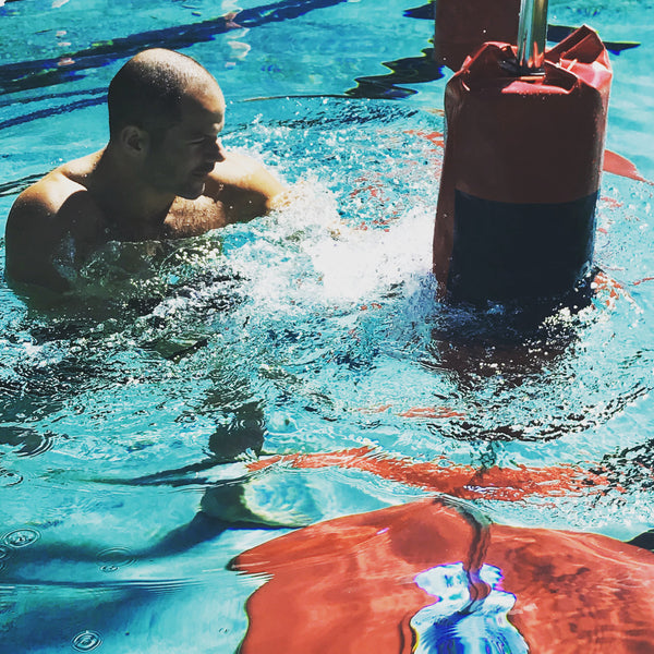 Man Kickboxing in Water