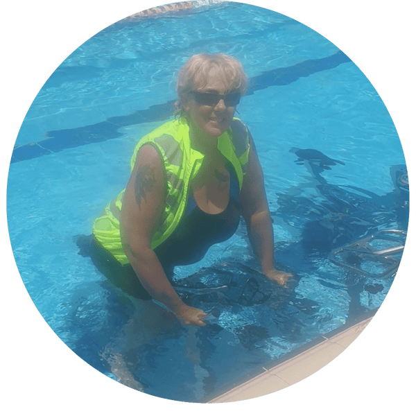 Woman water cycling for hip pain